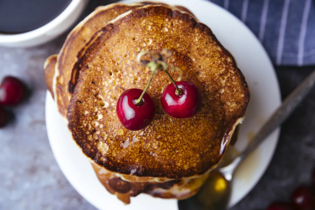 Fluffy ricotta pancakes with fresh cherries